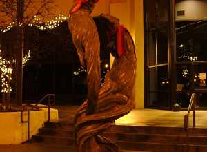 A bronze sculpture of two otters that a humorous soul dressed up for the season in front of the Wells Fargo bank at the corner of Phillips and 9th.