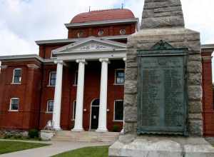 The 1904 Ashe County courthouse and World War II Honor Roll monument located in Jefferson, NC