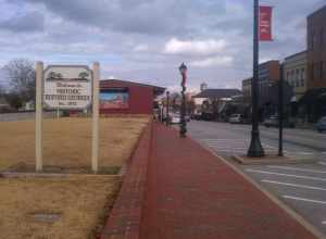 A photo of Main Street in Buford, Georgia including a "Welcome to Historic Buford, Georgia" sign.