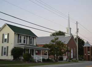 A house and the Donnelsville Lutheran Church, located on Main Street (U.S. Route 40) just west of the School Street intersection in Donnelsville, Ohio, United States.