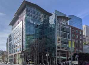 Offices of Slack Technologies at 500 Howard Street in San Francisco (at the center with neighboring buildings, seen from the back across Howard Street)