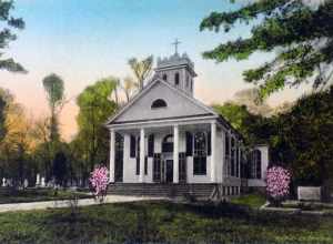 Photomechanical print (postcard) : albertype, hand colored 
Divided back 

The current building was built in 1857, although the parish existed from the early 18th century.