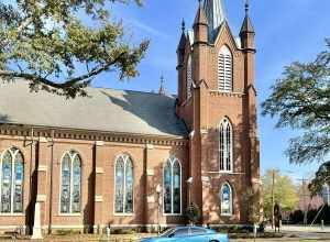 Built in 1872-1875, this Gothic Revival-style building was constructed for the congregation of Washington Street United Methodist Church.  The building features a red brick exterior, front-gable roof, gothic arched bays with stained glass windows and