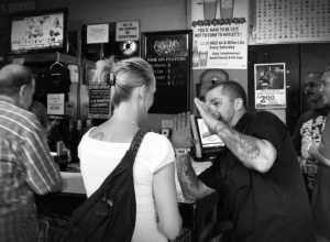 A journey through downtown Mobile Alabama during the 12th Annual Dauphin Street Beer Festival.
I couldn't tell very well, but it appeared that these two patrons were having an animated conversation about tattoos (i think).  Of course, you are free to