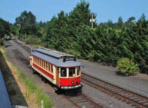 Willamette Shore Trolley car No. 514 approaching downtown Lake Oswego on August 16, 2014, the first day of service for this type of streetcar on the Willamette Shore line. Car 514 is a 1991-built replica of a Portland "Council Crest" car, a model of
