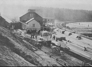 A photograph of the Connecticut River Lumber Company's mills on the banks of Log Pond Cove on the Connecticut River in Holyoke, Massachusetts.