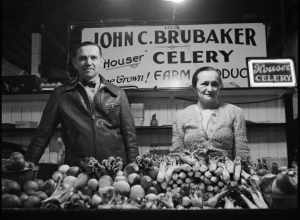 From Library of Congress metadata:
Title: Farmer and his wife at her stall in Central Market. Lancaster, Pennsylvania
Creator(s): Collins, Marjory, 1912-1985, photographer
Date Created/Published: 1942 Nov.
Medium: 1 negative : nitrate ; 2 1/4 x 2 1/4