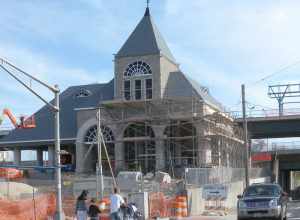 Looking southeast from Avenue C across 8th Street at new trolley terminal under construction on a sunny early afternoon.  See File:HBLR 8 St construction jeh.JPG for side view with sun.