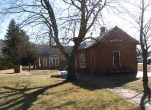 Western side of the Lyons Depot Library, located along Broadway in Lyons, Colorado, United States.  Now a library, the building was opened in 1885 as the Lyons Railroad Depot.  It is listed on the National Register of Historic Places.