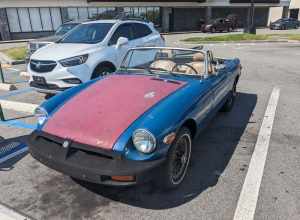 An MG MGB with mismatched panels parked in Palm Bay, Florida