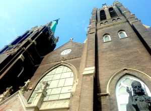 The front of St. Mary of Częstochowa Church in Cicero, Illinois and the head of the Christ Statue by Czesław Dźwiga
