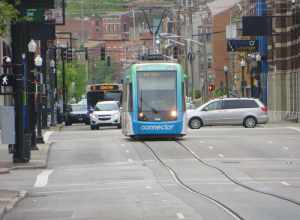 Telephoto view of a streetcar on the Cincinnati Bell Connector system, on Walnut Street near Central Parkway