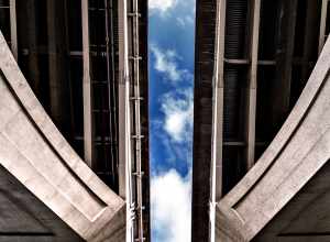
500px provided description: Another way to see the sky [#sky ,#blue ,#bridge ,#white ,#gray ,#cement]