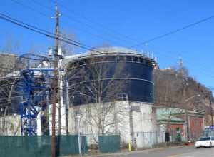 Looking northwest across River Road at Woodcliff Treatment Plant on a sunny midday.
