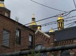 500px provided description: A Polish church in the Strip District, Pittsburgh. [#city ,#church ,#buildings ,#urban ,#architecture ,#roof ,#gold ,#usa ,#brick ,#strip ,#district ,#pennsylvania ,#united states ,#catholic ,#crosses ,#pittsburgh
