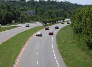 A City of Chapel Hill, North Carolina police cruiser laying a speed trap on US 15-501.  The trees in the median give him effective cover from the motorists facing the camera.