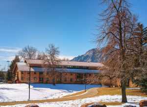 Buckingham Hall undergraduate student housing dorm at the University of Colorado Boulder (CU Boulder) campus in Boulder, Colorado, with the Flatirons in the distance.