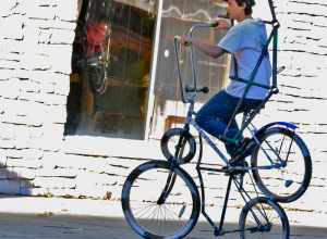 I caught this guy taking his contraption out for a spin one sunny afternoon in Gainesville Florida outside of "Spin Cycle," bike shop. 

The exposure on the back wall is really hot but other than than that not bad. Looks like it's a combo of two
