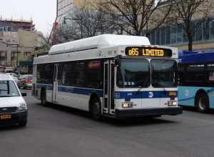 A Jamaica LIRR-bound Q65 Limited bus traveling south on Main Street between Northern Boulevard and 37th Avenue in Downtown Flushing, Queens.