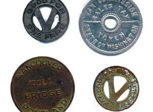 Three bus, toll-bridge and sales-tax tokens used in or around Vancouver, Washington, in the mid-20th century. The hollowed "V" coin reads "VANCOUVER BUS COMPANY" on one side and "GOOD FOR ONE FARE" on the opposite. The "VANCOUVER PORTLAND TOLL