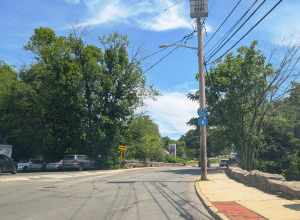 Photo of northbound U.S. Route 1 (North Main Street) in Port Chester, New York approaching a traffic circle straddling the Connecticut state line. Photo taken looking north-northeast at Putnam Avenue.